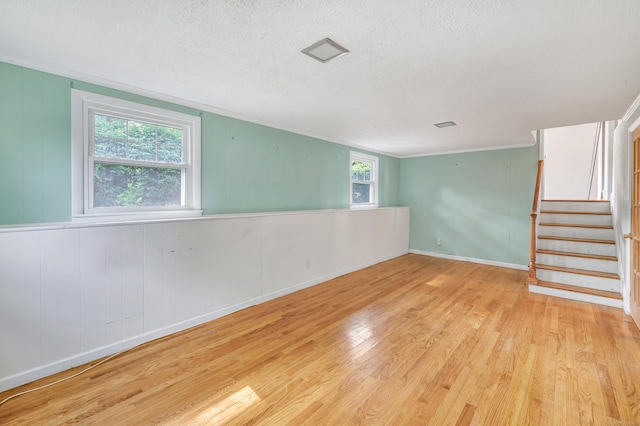 12 Sugar Plum Ln, Fairfield, CT 06824 - spare room featuring wood finished floors, a textured ceiling, stairs, and baseboards