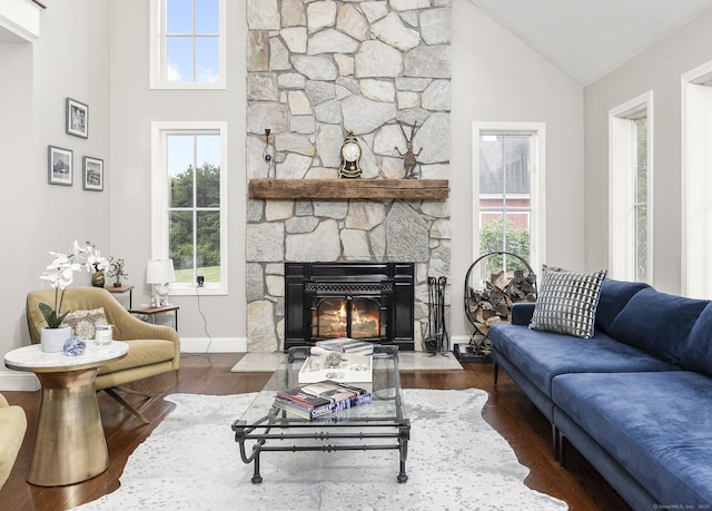 168 Fern Ave, Litchfield, CT 06759 - living room featuring healthy amount of natural light, high vaulted ceiling, wood finished floors, a stone fireplace, and baseboards