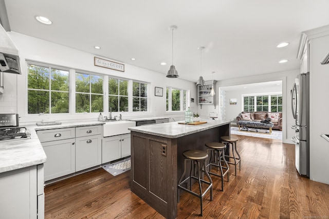168 Fern Ave, Litchfield, CT 06759 - kitchen with a sink, freestanding refrigerator, a kitchen island, dark wood-style floors, and recessed lighting
