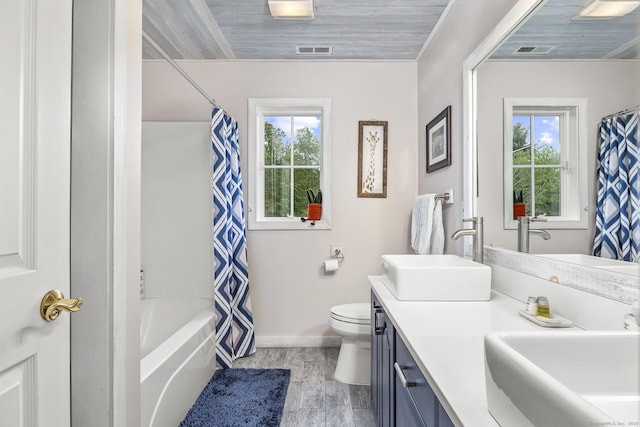 168 Fern Ave, Litchfield, CT 06759 - full bathroom featuring vanity, toilet, baseboards, wood finished floors, and shower / bath combo