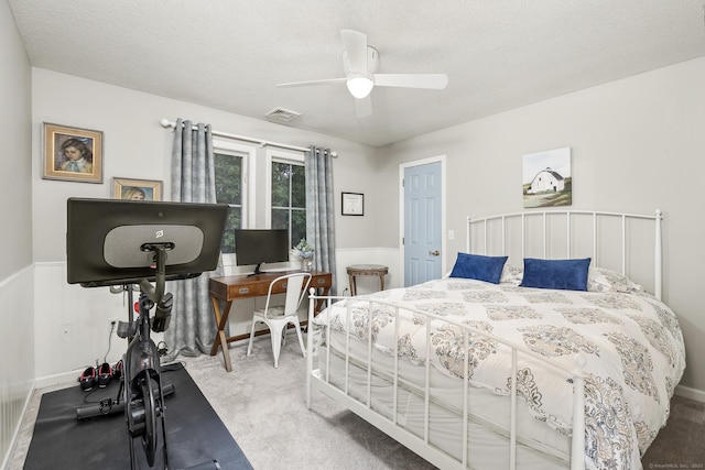 168 Fern Ave, Litchfield, CT 06759 - bedroom with carpet flooring, a textured ceiling, a wainscoted wall, and ceiling fan