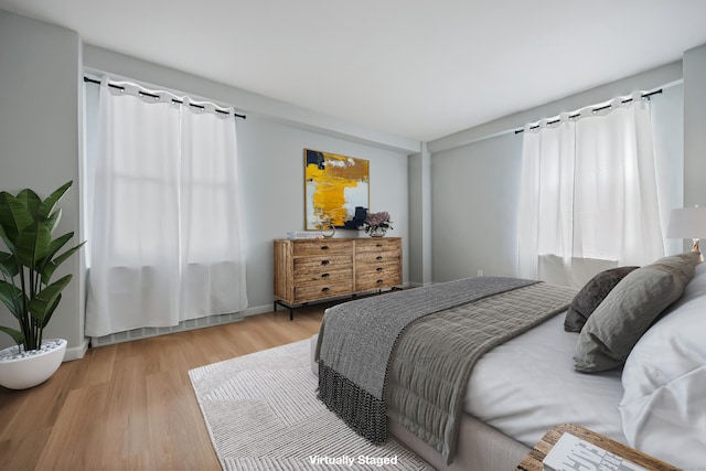 71 Strawberry Hill Ave Unit 710, Stamford, CT 06902 - bedroom with light wood-type flooring and baseboards