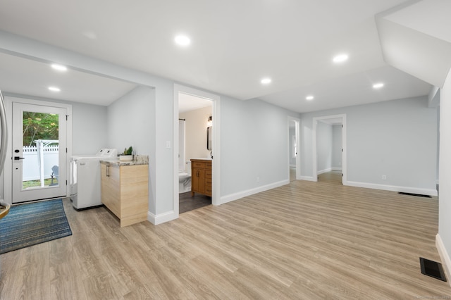 19 Old Acres Rd, East Haddam, CT 06469 - unfurnished living room with washing machine and dryer, light wood-style flooring, baseboards, and recessed lighting