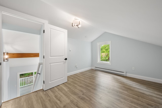 19 Old Acres Rd, East Haddam, CT 06469 - bonus room featuring a baseboard heating unit, lofted ceiling, wood finished floors, and baseboards