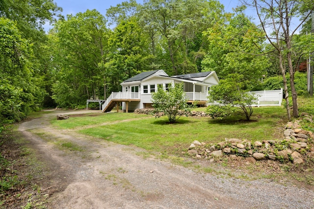19 Old Acres Rd, East Haddam, CT 06469 - view of front of house featuring stairs, roof mounted solar panels, dirt driveway, and a wooden deck