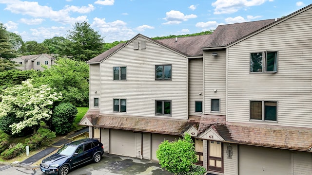 489 Wolcott St Apt 42, Bristol, CT 06010 - view of property with an attached garage and driveway