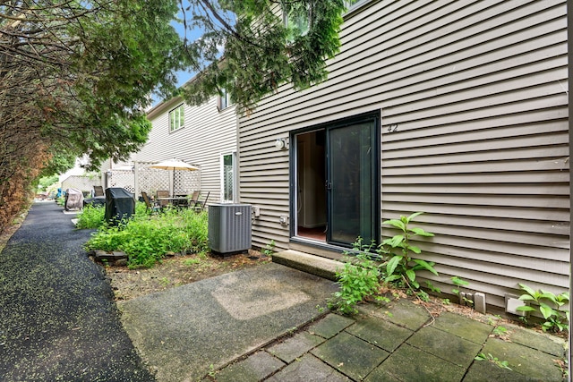 489 Wolcott St Apt 42, Bristol, CT 06010 - doorway to property featuring central air condition unit and a patio area