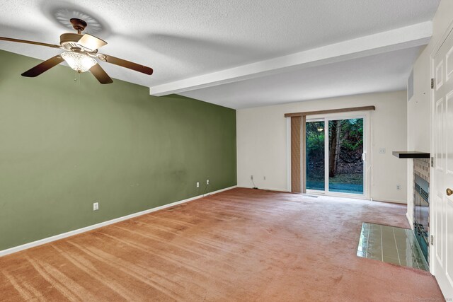 489 Wolcott St Apt 42, Bristol, CT 06010 - unfurnished living room featuring carpet flooring, a tile fireplace, beam ceiling, a ceiling fan, and baseboards