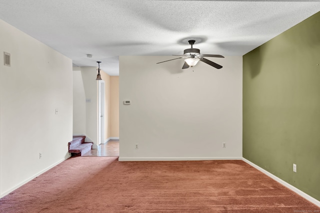 489 Wolcott St Apt 42, Bristol, CT 06010 - empty room with carpet, ceiling fan, stairs, baseboards, and a textured ceiling