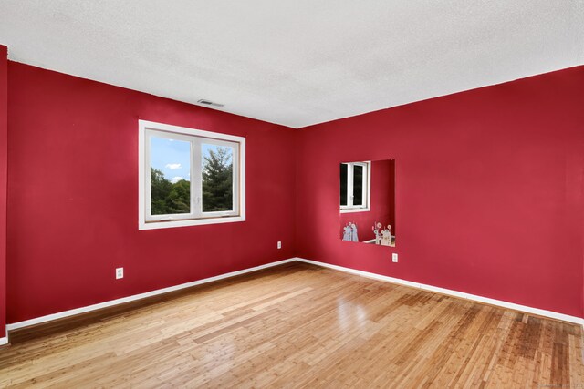 489 Wolcott St Apt 42, Bristol, CT 06010 - empty room featuring wood finished floors and baseboards