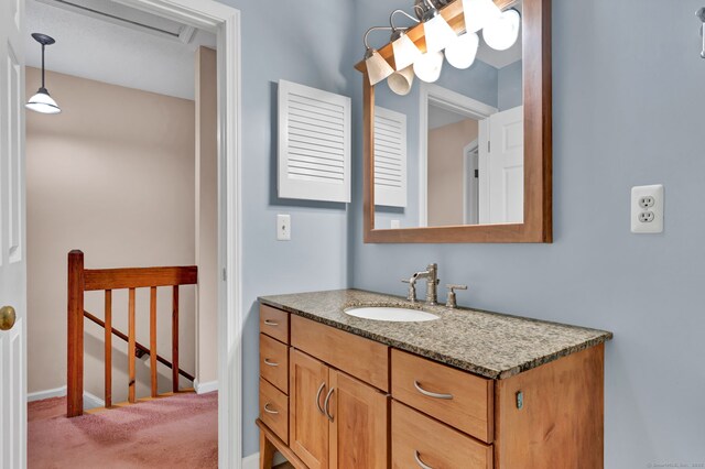 489 Wolcott St Apt 42, Bristol, CT 06010 - bathroom featuring vanity and baseboards