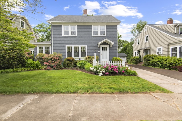 61 Lake St, Hamden, CT 06517 - colonial house with a chimney, a front yard, and a shingled roof