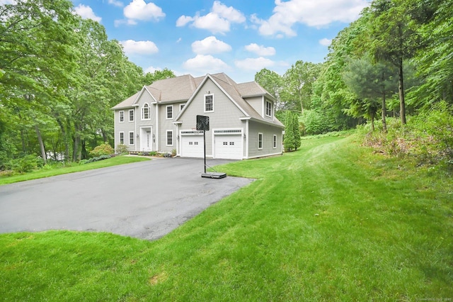 5 Jonathan Dr, Ellington, CT 06029 - view of front facade featuring driveway, a garage, and a front yard