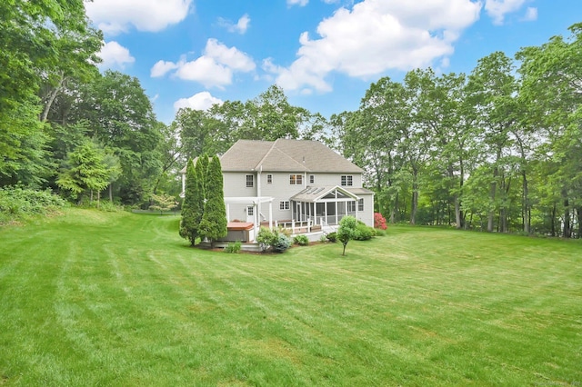 5 Jonathan Dr, Ellington, CT 06029 - rear view of property featuring a sunroom, a deck, and a yard