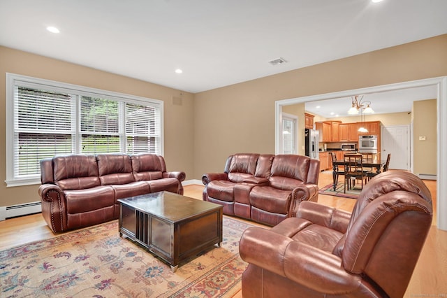 5 Jonathan Dr, Ellington, CT 06029 - living room with recessed lighting, light wood-type flooring, and a baseboard heating unit