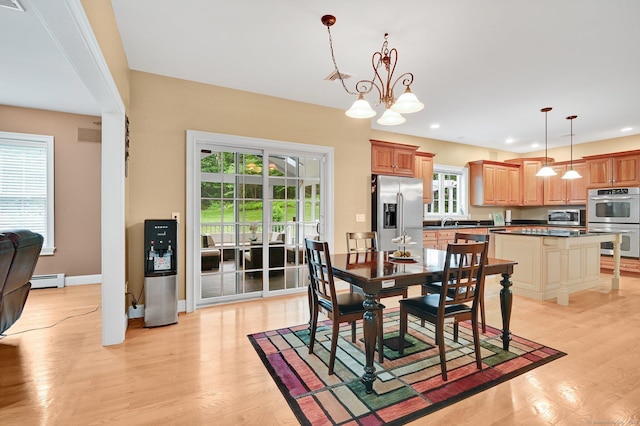 5 Jonathan Dr, Ellington, CT 06029 - dining space featuring a chandelier, light wood finished floors, a baseboard heating unit, recessed lighting, and baseboards