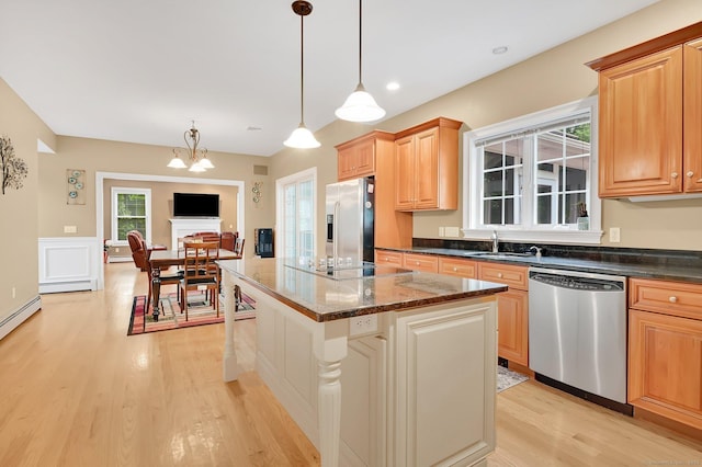 5 Jonathan Dr, Ellington, CT 06029 - kitchen with stainless steel appliances, light wood-type flooring, a kitchen island, a sink, and decorative light fixtures