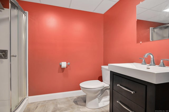 5 Jonathan Dr, Ellington, CT 06029 - bathroom featuring toilet, vanity, baseboards, a paneled ceiling, and a shower stall