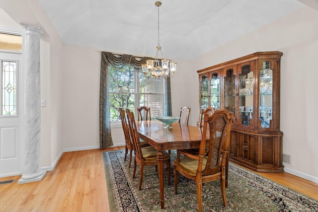 192 Rosewood Ln Unit 192, Berlin, CT 06037 - dining area with a chandelier, healthy amount of natural light, ornate columns, and light wood-type flooring