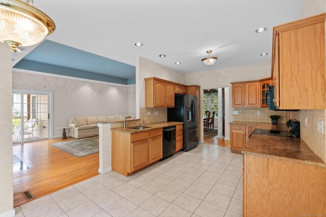192 Rosewood Ln Unit 192, Berlin, CT 06037 - kitchen with black appliances, a sink, light tile patterned floors, decorative backsplash, and open floor plan