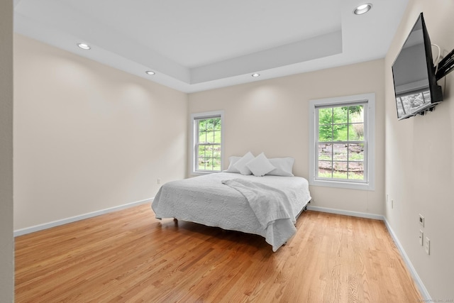 192 Rosewood Ln Unit 192, Berlin, CT 06037 - bedroom with multiple windows, light wood-type flooring, recessed lighting, baseboards, and a raised ceiling
