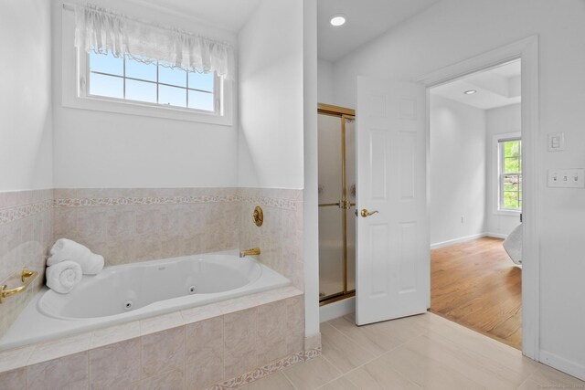 192 Rosewood Ln Unit 192, Berlin, CT 06037 - bathroom with a tub with jets, a stall shower, tile patterned floors, and baseboards