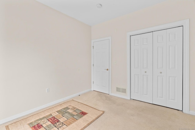 192 Rosewood Ln Unit 192, Berlin, CT 06037 - unfurnished bedroom featuring light carpet, baseboards, and a closet