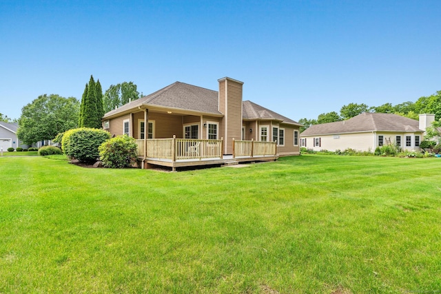 192 Rosewood Ln Unit 192, Berlin, CT 06037 - back of house with a chimney, a yard, and a wooden deck