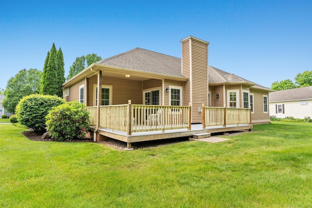 192 Rosewood Ln Unit 192, Berlin, CT 06037 - rear view of property with a chimney, a deck, a yard, and roof with shingles
