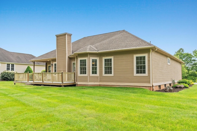 192 Rosewood Ln Unit 192, Berlin, CT 06037 - rear view of house featuring a deck, a chimney, and a yard