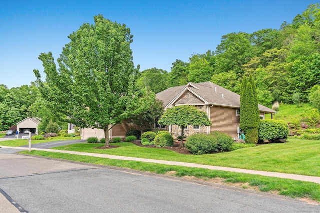192 Rosewood Ln Unit 192, Berlin, CT 06037 - view of property exterior featuring a lawn and a garage