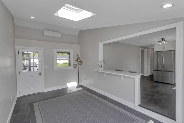 37 Litchfield Dr, Enfield, CT 06082 - entryway with a wall mounted air conditioner, baseboards, a skylight, vaulted ceiling, and recessed lighting
