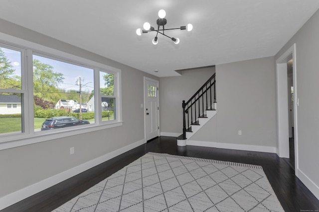 37 Litchfield Dr, Enfield, CT 06082 - entryway featuring a chandelier, baseboards, dark wood-style flooring, and stairway
