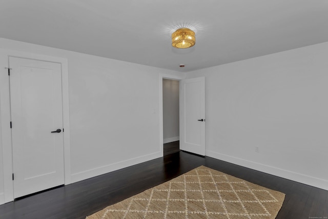 37 Litchfield Dr, Enfield, CT 06082 - empty room with baseboards and dark wood-style flooring