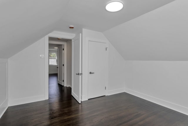 37 Litchfield Dr, Enfield, CT 06082 - additional living space featuring dark wood-style floors, vaulted ceiling, and baseboards