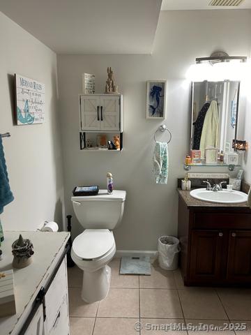 663 W Ave Unit A21, Milford, CT 06461 - bathroom with vanity, toilet, and tile patterned floors