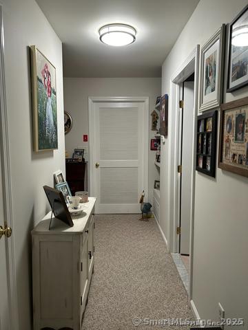 663 W Ave Unit A21, Milford, CT 06461 - hallway with light carpet