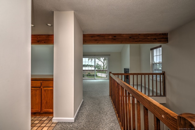 107 Ferry Ct Unit 107, Stratford, CT 06615 - hallway featuring a textured ceiling, beamed ceiling, light colored carpet, an upstairs landing, and recessed lighting
