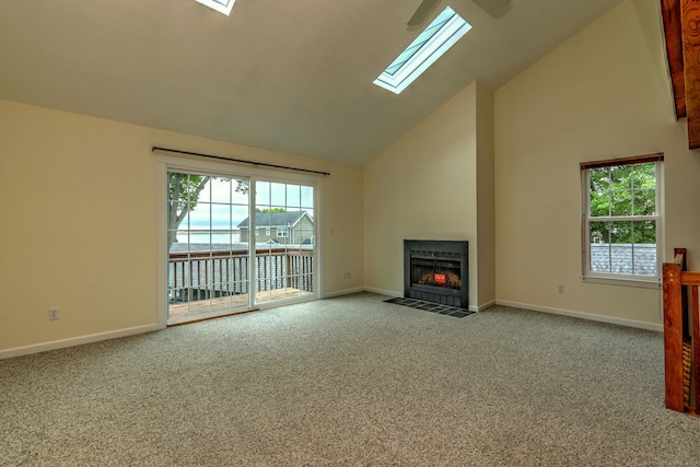 107 Ferry Ct Unit 107, Stratford, CT 06615 - unfurnished living room featuring carpet floors, a fireplace with flush hearth, high vaulted ceiling, a skylight, and baseboards