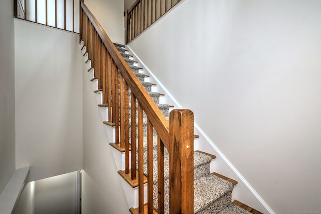 107 Ferry Ct Unit 107, Stratford, CT 06615 - stairway with baseboards and wood finished floors