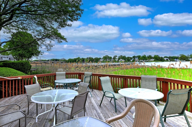 107 Ferry Ct Unit 107, Stratford, CT 06615 - wooden terrace with outdoor dining area and a water view