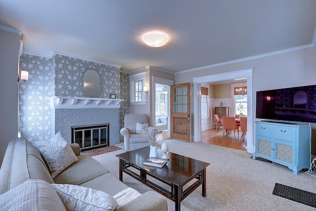 59 Golf St, Newington, CT 06111 - living room featuring ornamental molding, plenty of natural light, carpet, a chandelier, and a brick fireplace