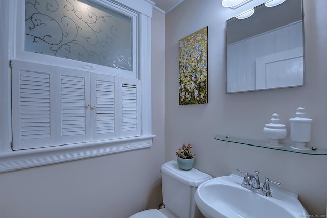 59 Golf St, Newington, CT 06111 - half bathroom featuring a sink, toilet, and crown molding