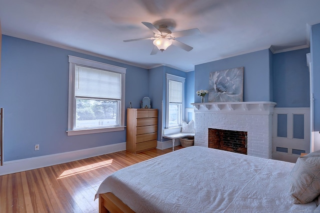 59 Golf St, Newington, CT 06111 - bedroom featuring wood finished floors, baseboards, a brick fireplace, crown molding, and a ceiling fan