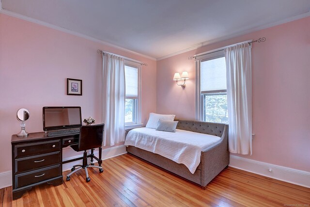 59 Golf St, Newington, CT 06111 - bedroom featuring multiple windows, light wood-type flooring, ornamental molding, baseboards, and an office area