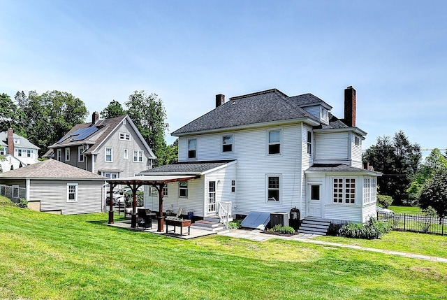 59 Golf St, Newington, CT 06111 - back of house featuring a chimney, a patio area, an outdoor hangout area, and entry steps