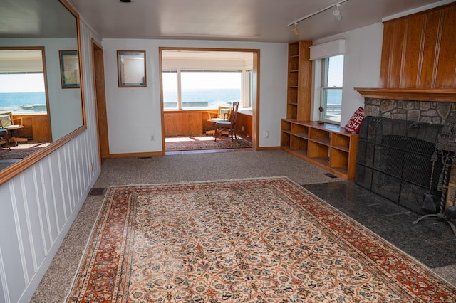 28 Morgan Ter, East Haven, CT 06512 - living area with a fireplace, track lighting, and baseboards