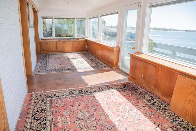 28 Morgan Ter, East Haven, CT 06512 - unfurnished sunroom featuring a water view, ornamental molding, and wood walls