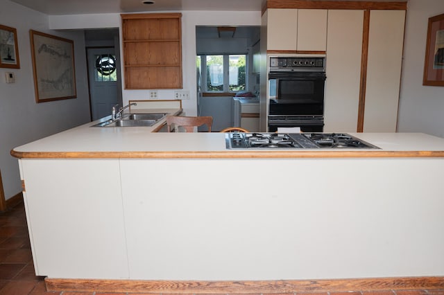 28 Morgan Ter, East Haven, CT 06512 - kitchen featuring a sink, open shelves, gas stovetop, and light countertops