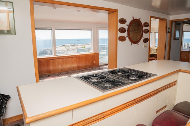 28 Morgan Ter, East Haven, CT 06512 - kitchen featuring stovetop with downdraft, white cabinets, and light countertops